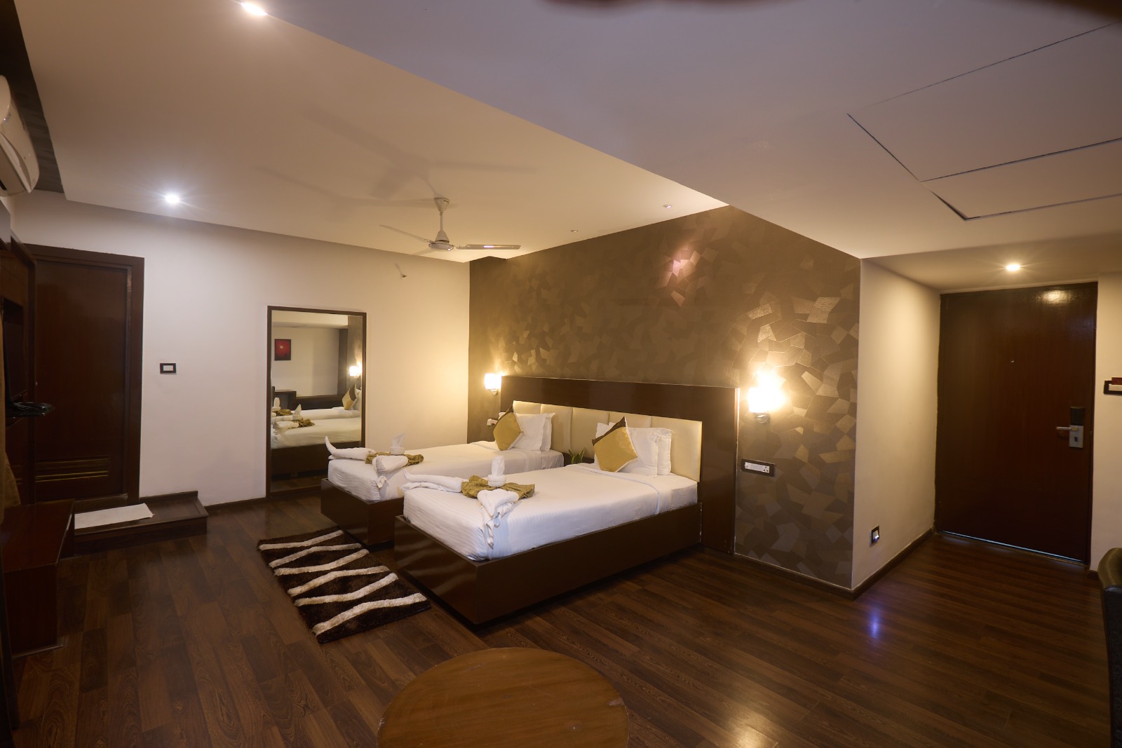 Spacious guest room at Hotel Hemaadri Grand
